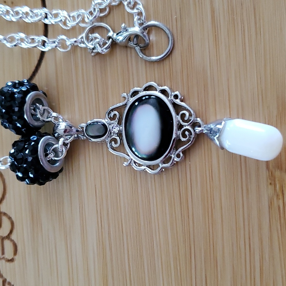 This a 17 inche necklace with a beautiful charm .